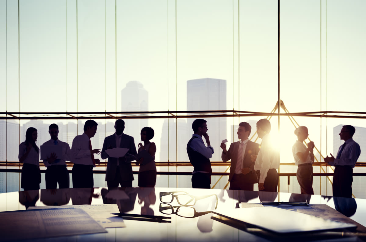Business leaders networking at event